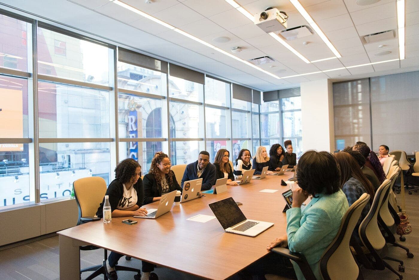 A team working around a long boardroom table